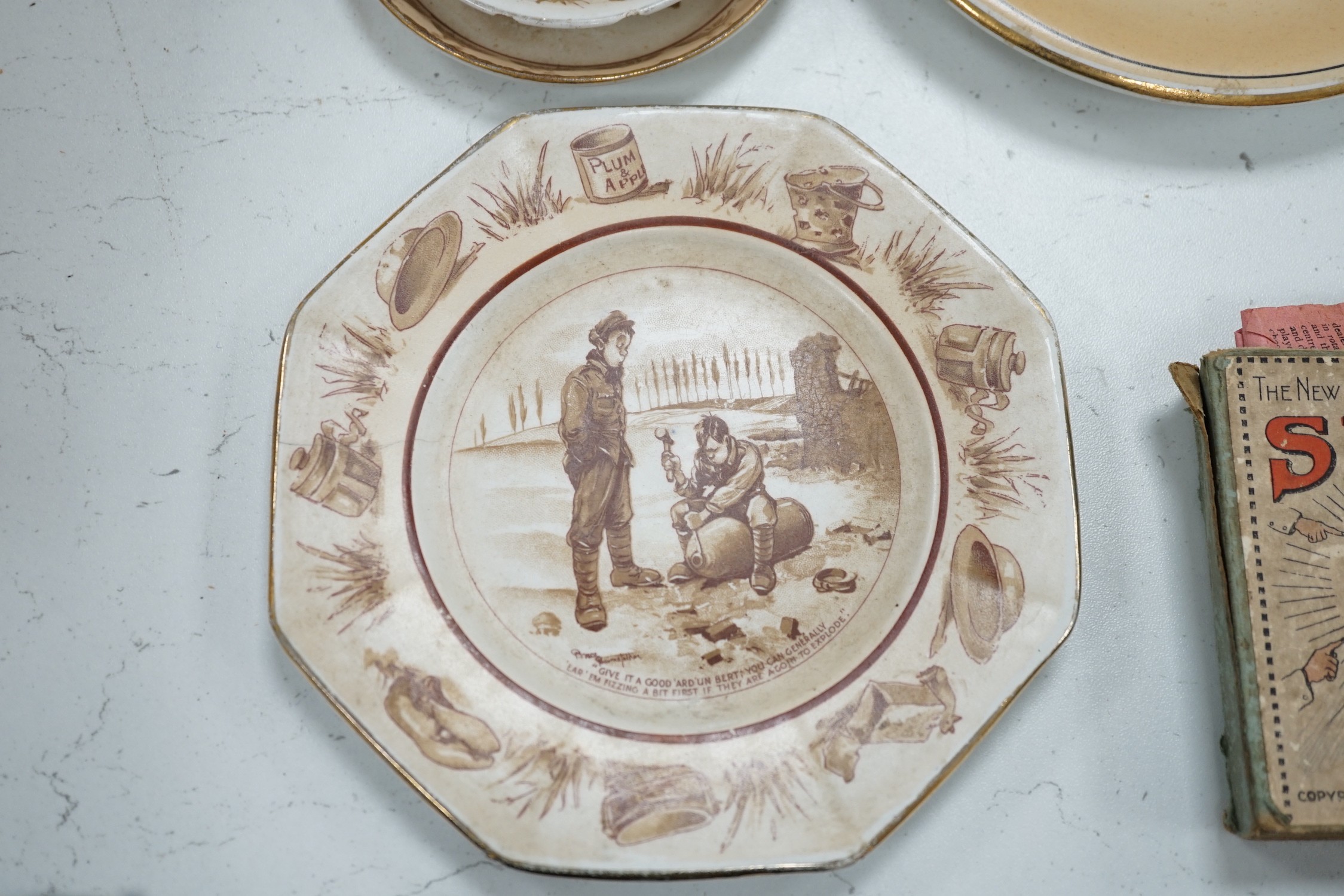 WWI commemorative Grimwades ‘Old Bill’ ceramics, including a jug, a bowl, five various dishes and a moustache cup and saucer, together with two novelty character jugs and a spy card game
